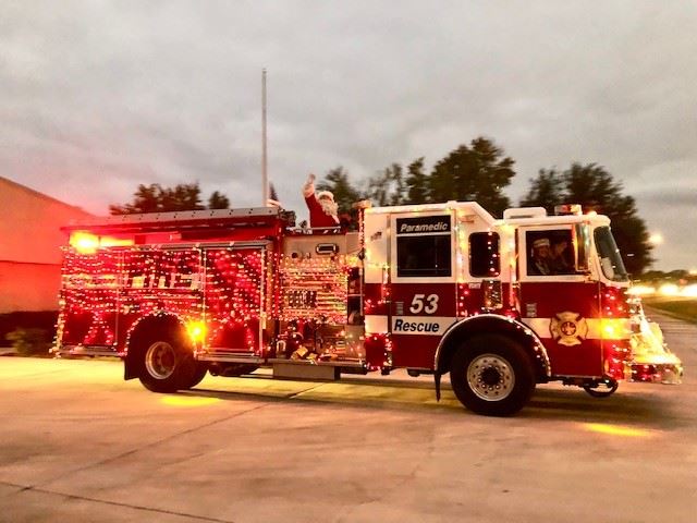 Santa on Fire Truck decorated with lights